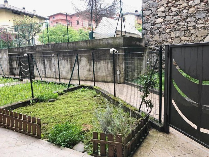 Bilocale con giardino privato e box