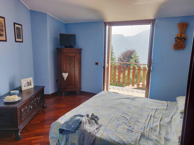 Villetta a schiera immersa nel verde Albino