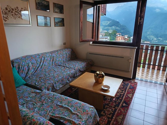 Oltre il Colle, panoramico bilocale balconato con camino e box auto Oltre il Colle